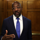 U.S. Sen. Raphael Warnock (D-GA) talks to members of the press as he arrives at the U.S. Capitol for a cloture vote on September 27, 2022, in Washington, DC. The Senate passed a cloture vote of a continuing resolution to fund the government after an oil and gas permitting regulations portion, backed by Sen. Manchin, was removed from the short-term funding bill.